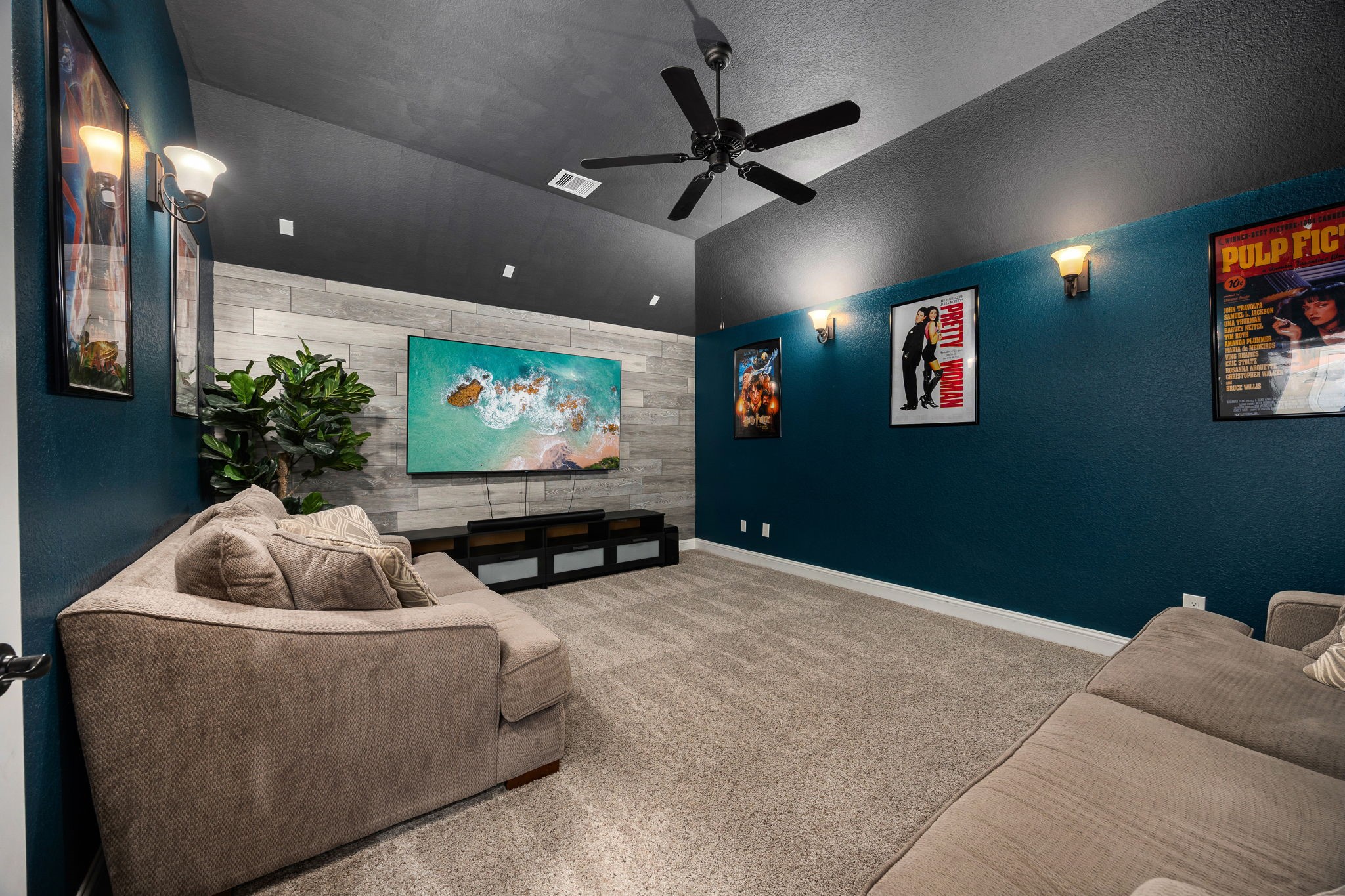 4225 Grand Oaks Wind Spring, TX 77386 - Photo 21 of 40 a living room with furniture and a flat screen tv