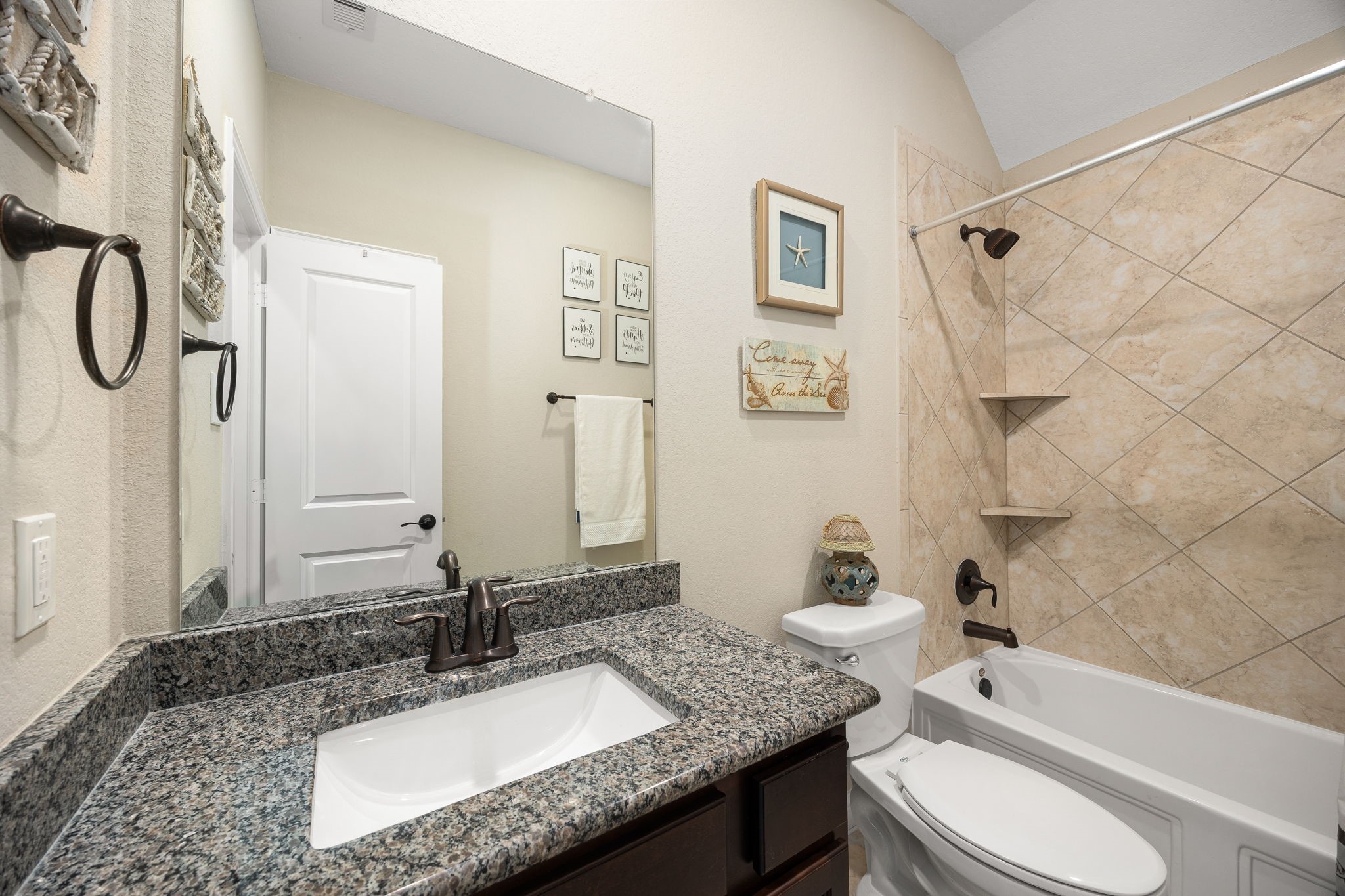 4225 Grand Oaks Wind Spring, TX 77386 - Photo 30 of 40 a bathroom with a granite countertop sink toilet and shower