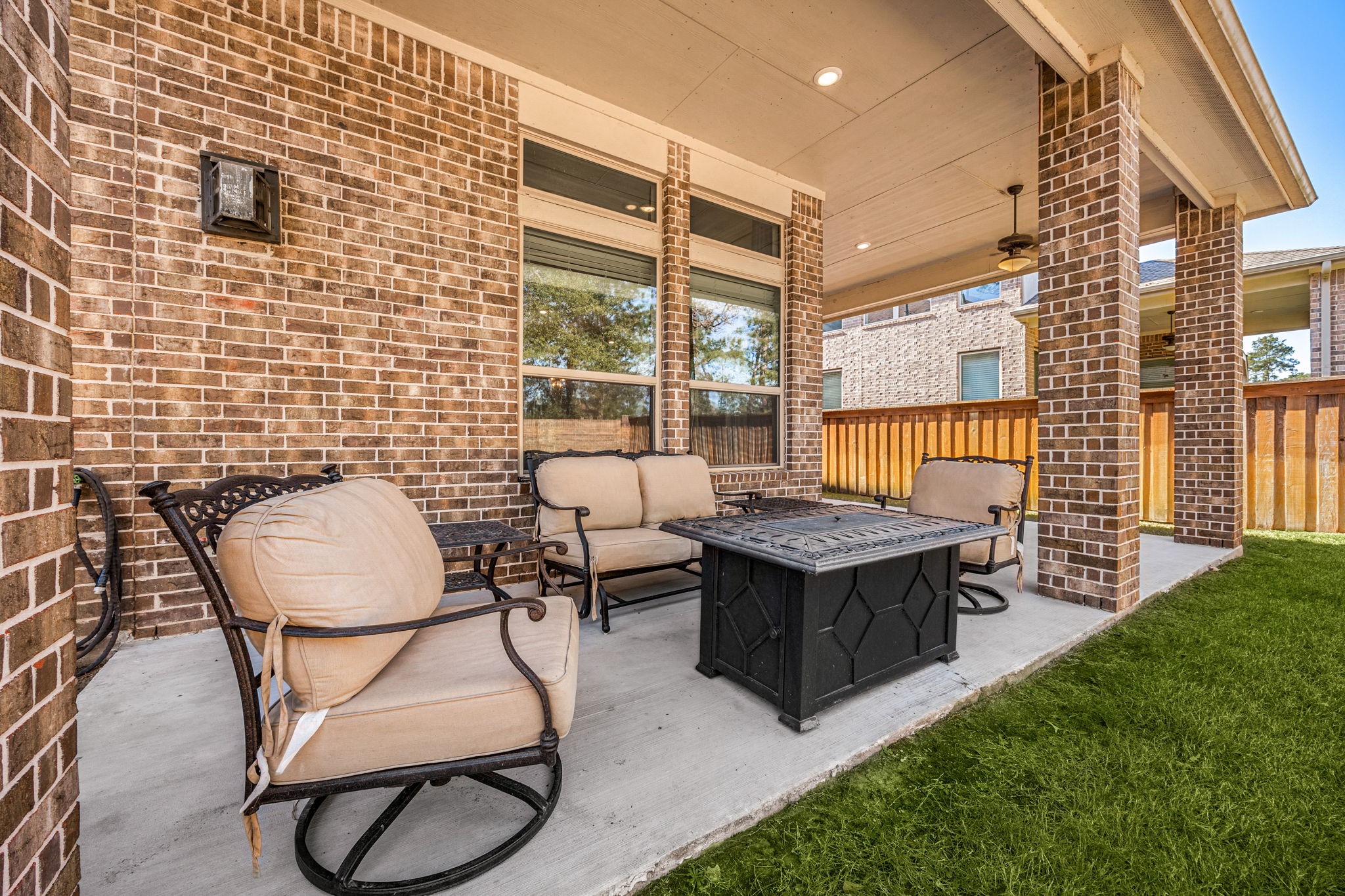 4225 Grand Oaks Wind Spring, TX 77386 - Photo 35 of 40 a view of a patio with table and chairs with wooden floor and fence