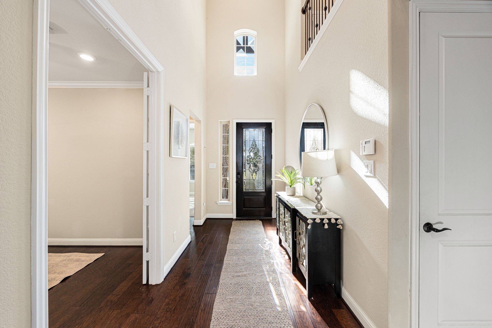 4225 Grand Oaks Wind Spring, TX 77386 - Photo 4 of 40 a hall way with wooden floor and stairs