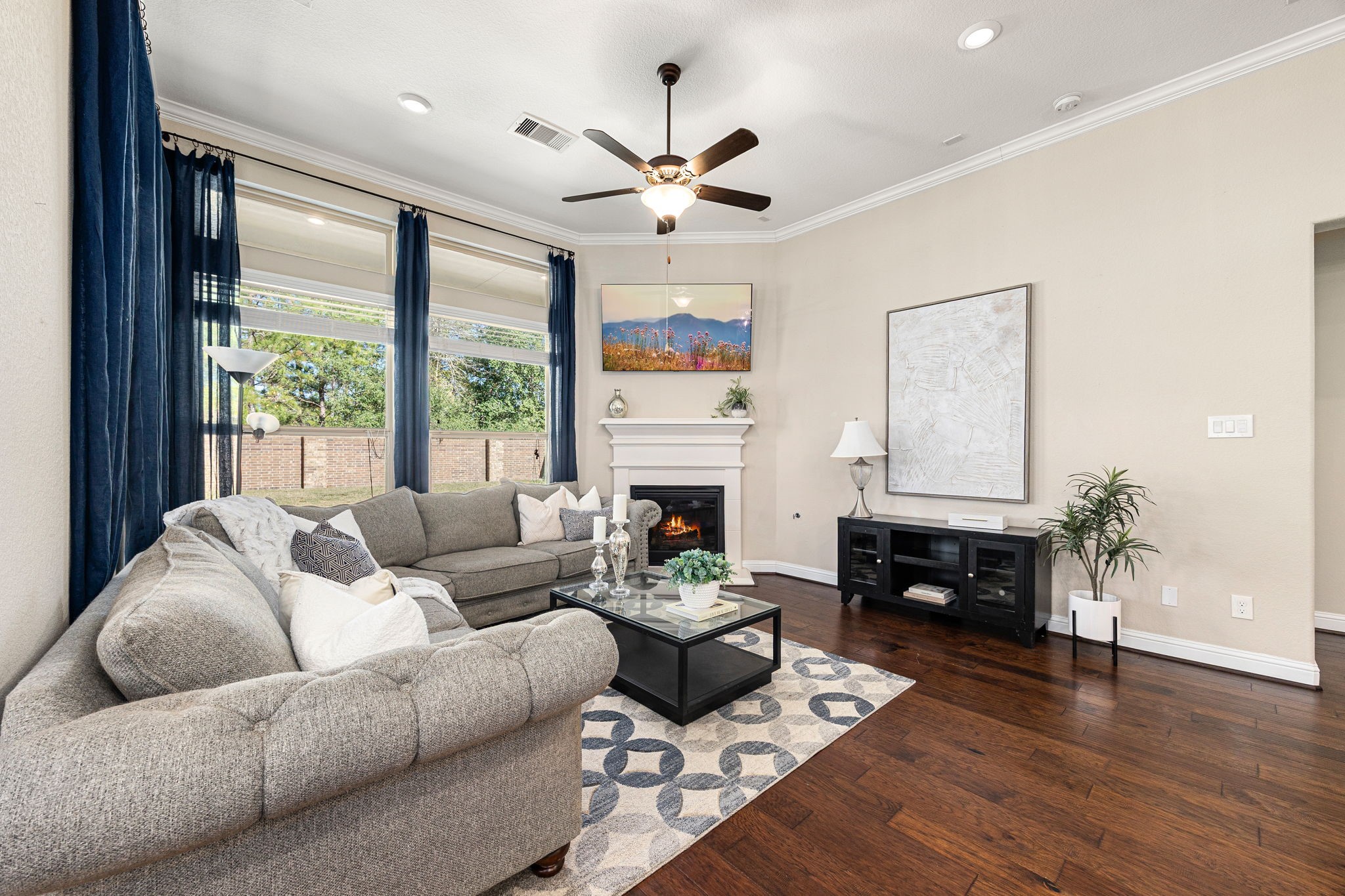 4225 Grand Oaks Wind Spring, TX 77386 - Photo 5 of 40 a living room with furniture fireplace and a large window