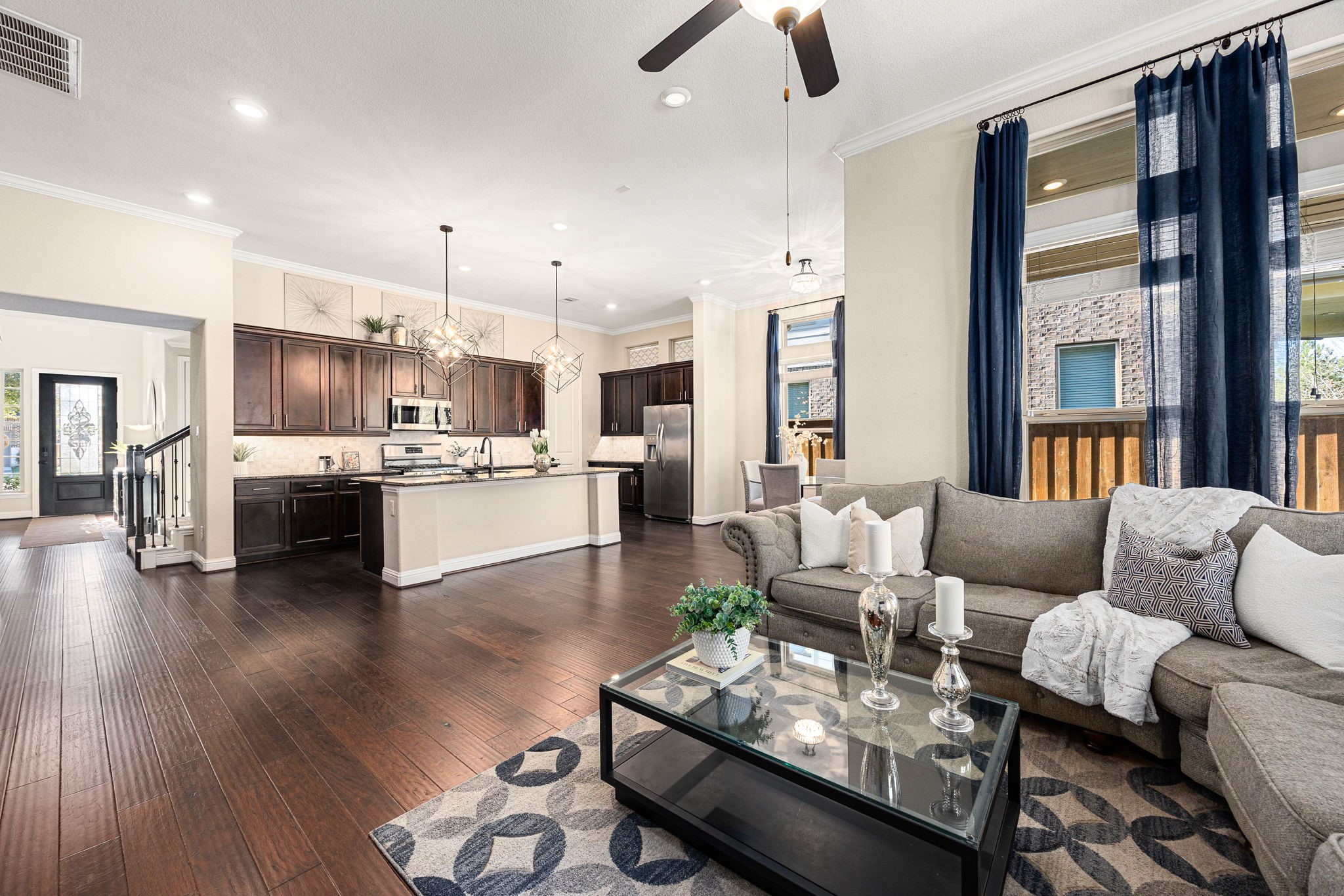 4225 Grand Oaks Wind Spring, TX 77386 - Photo 7 of 40 a living room with furniture kitchen and a wooden floor