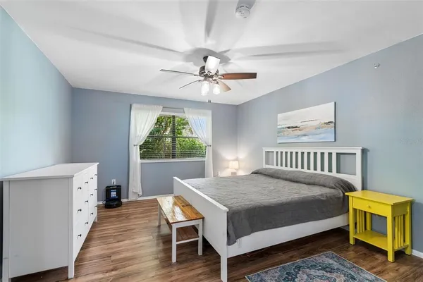 a bed room with a bed and a chandelier