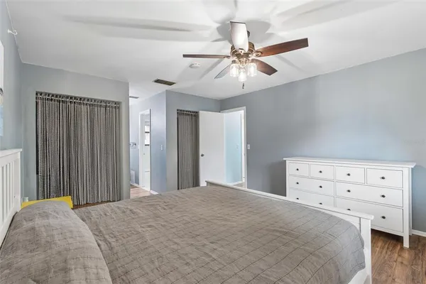 a bedroom with a bed and a table