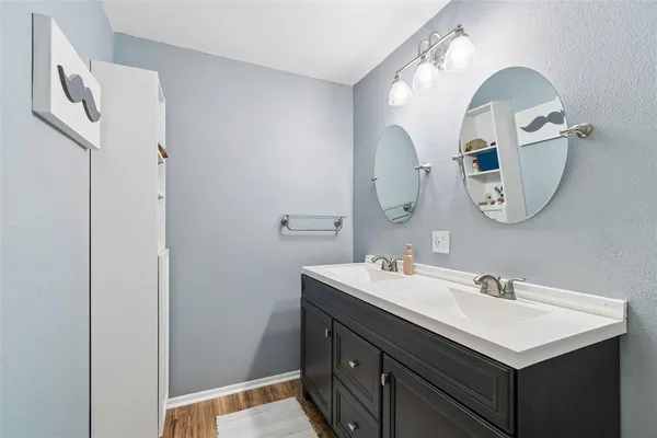 a bathroom with a sink and a mirror