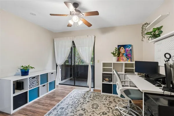 a workspace with furniture and a potted plant