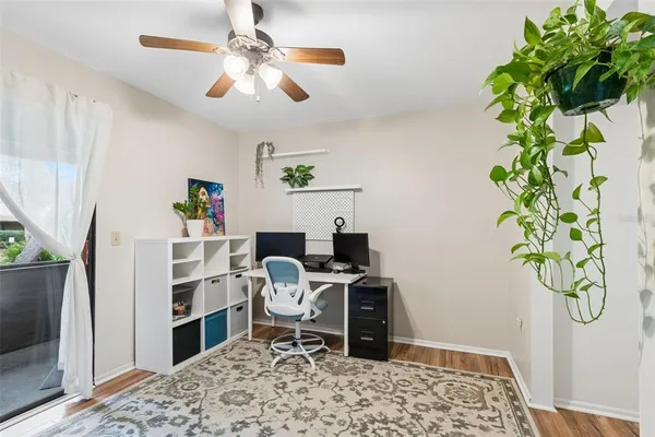 a workspace with furniture and a potted plant