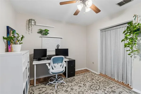 a workspace with furniture and a potted plant