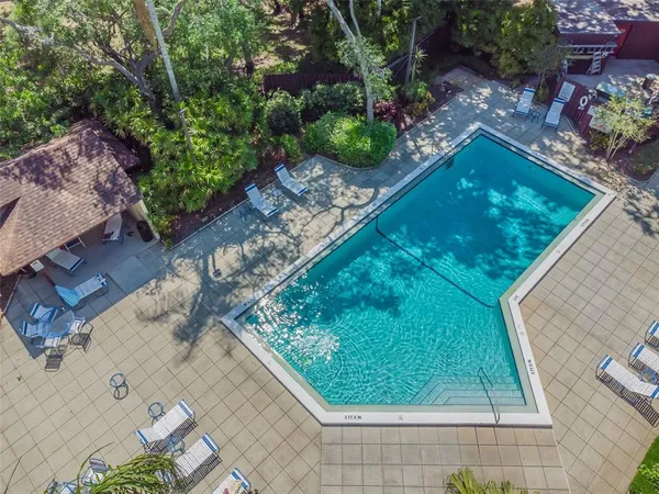 an aerial view of a residential houses with outdoor space