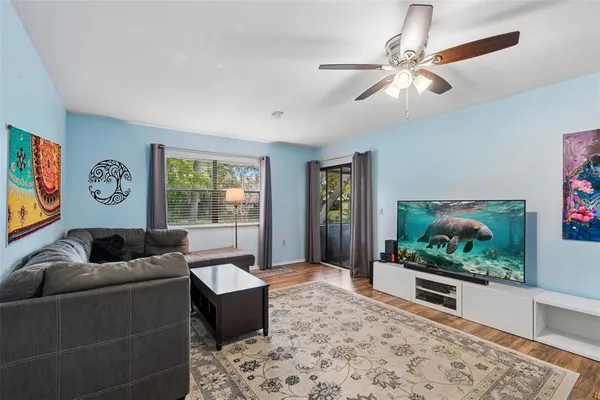 a living room with furniture and a flat screen tv