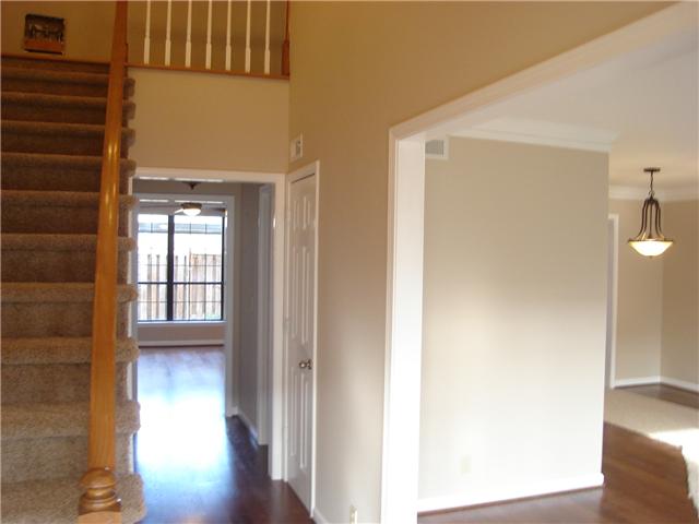 1284 Gen George Patton Road, Unit 1284 Nashville, TN 37221 - Photo 2 of 20 Light-filled foyer. To right is living/dining room. Straight ahead is den.