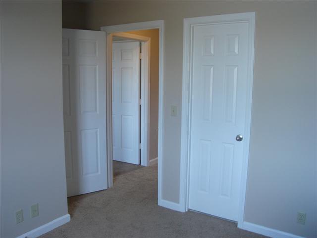 1284 Gen George Patton Road, Unit 1284 Nashville, TN 37221 - Photo 12 of 20 Second bedroom with door leading to hall and door on right leads to full bath on second floor. This bath has a large vanity.