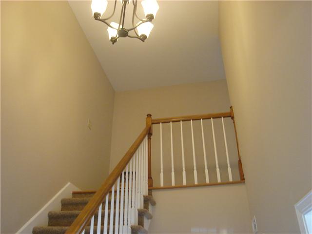 1284 Gen George Patton Road, Unit 1284 Nashville, TN 37221 - Photo 3 of 20 Stairs off foyer leading to three bedrooms. There is a linen closet at top of stairs.