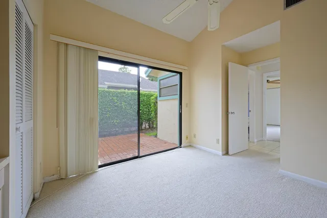 a view of empty room with floor to ceiling window