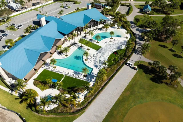an aerial view of a house with a swimming pool
