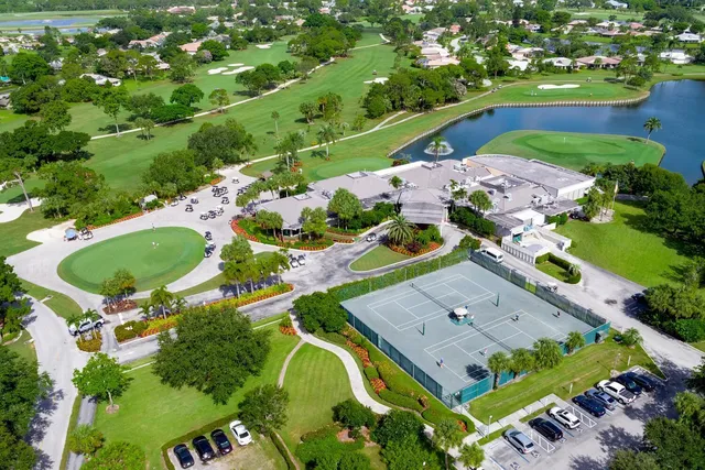 an aerial view of a pool patio chairs and fire pit
