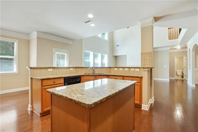 a kitchen with a stove a sink and a refrigerator