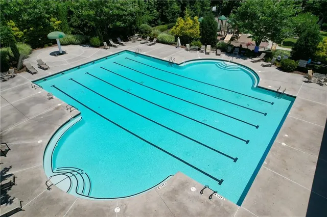 a view of a backyard with swings