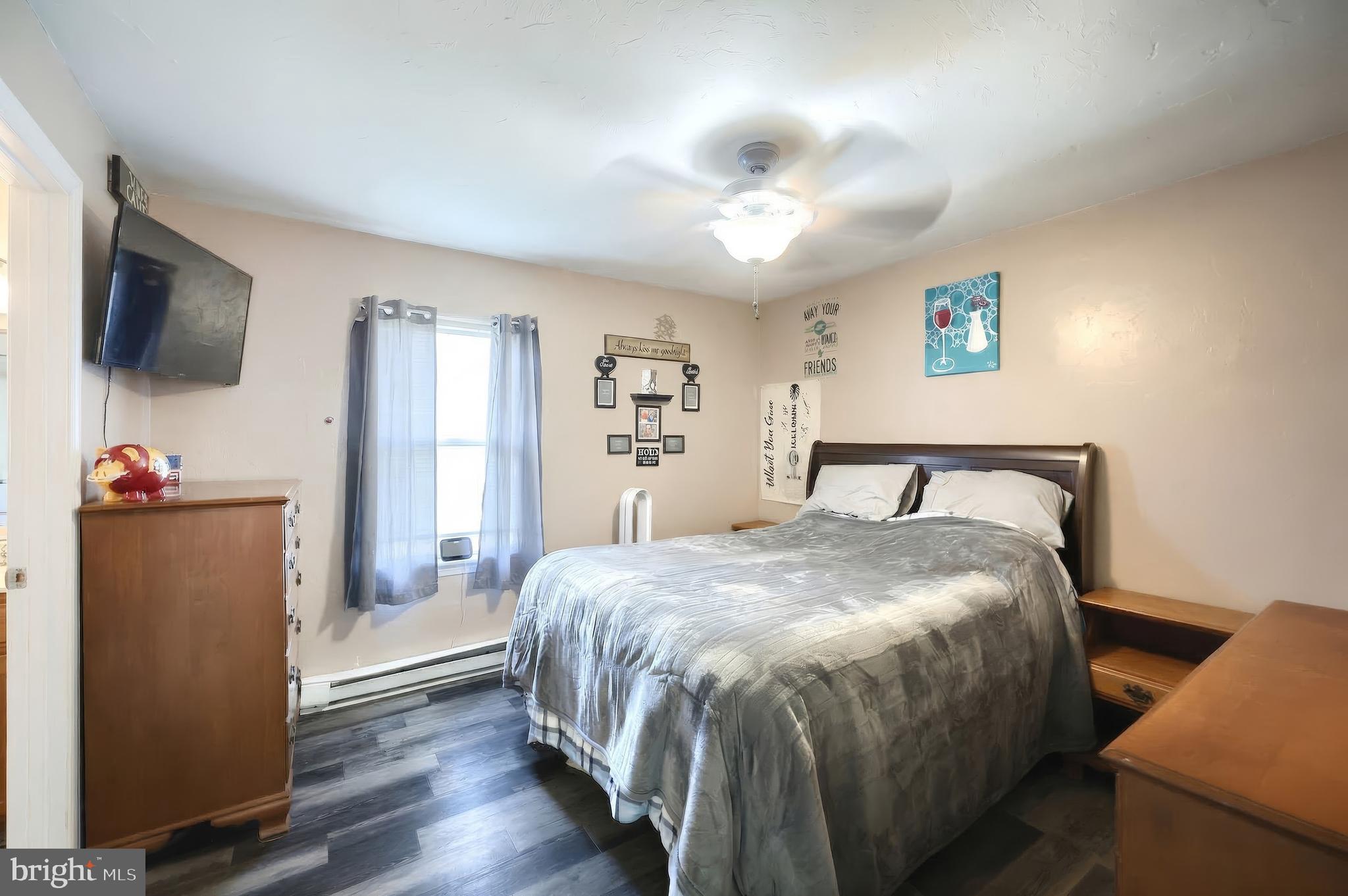 3551 Ruffed Grouse Drive Dover, PA 17315 - Photo 11 of 30 a bedroom with a bed and a flat screen tv