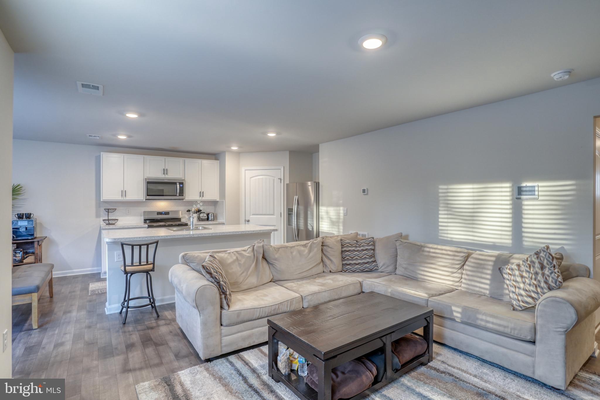 124 Currant Circle Magnolia, DE 19962 - Photo 17 of 45 a living room with furniture and a large window