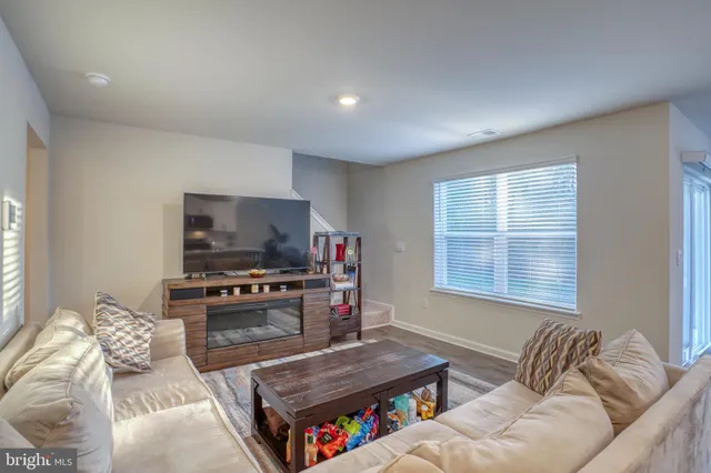 a kitchen with a stove a sink a microwave and a refrigerator