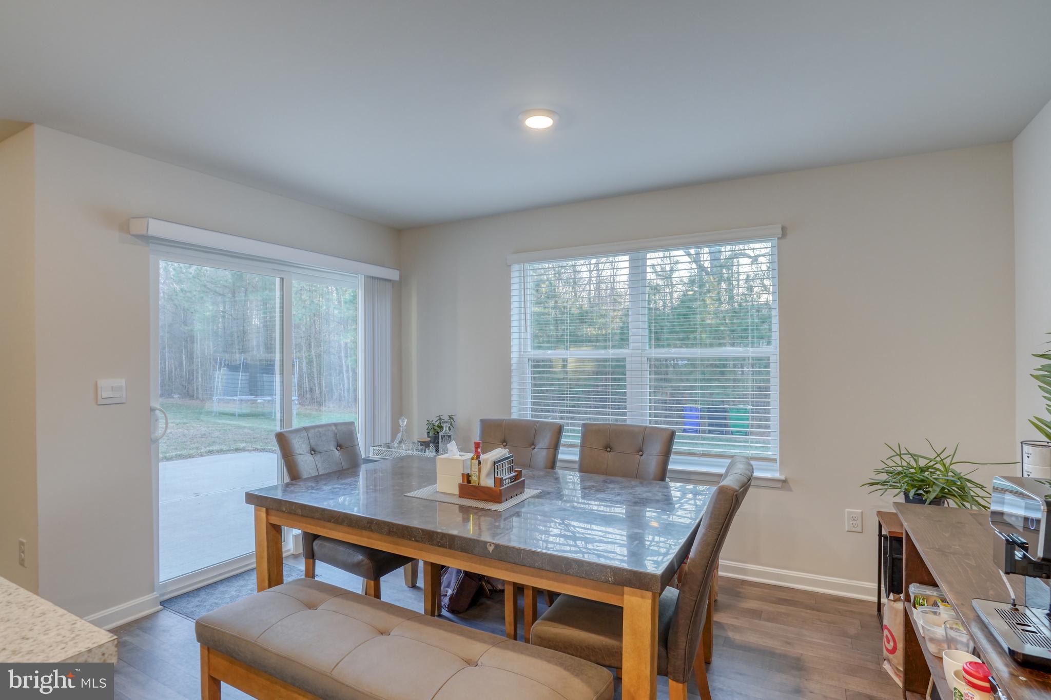 124 Currant Circle Magnolia, DE 19962 - Photo 26 of 45 a view of a dining room with furniture window and wooden floor