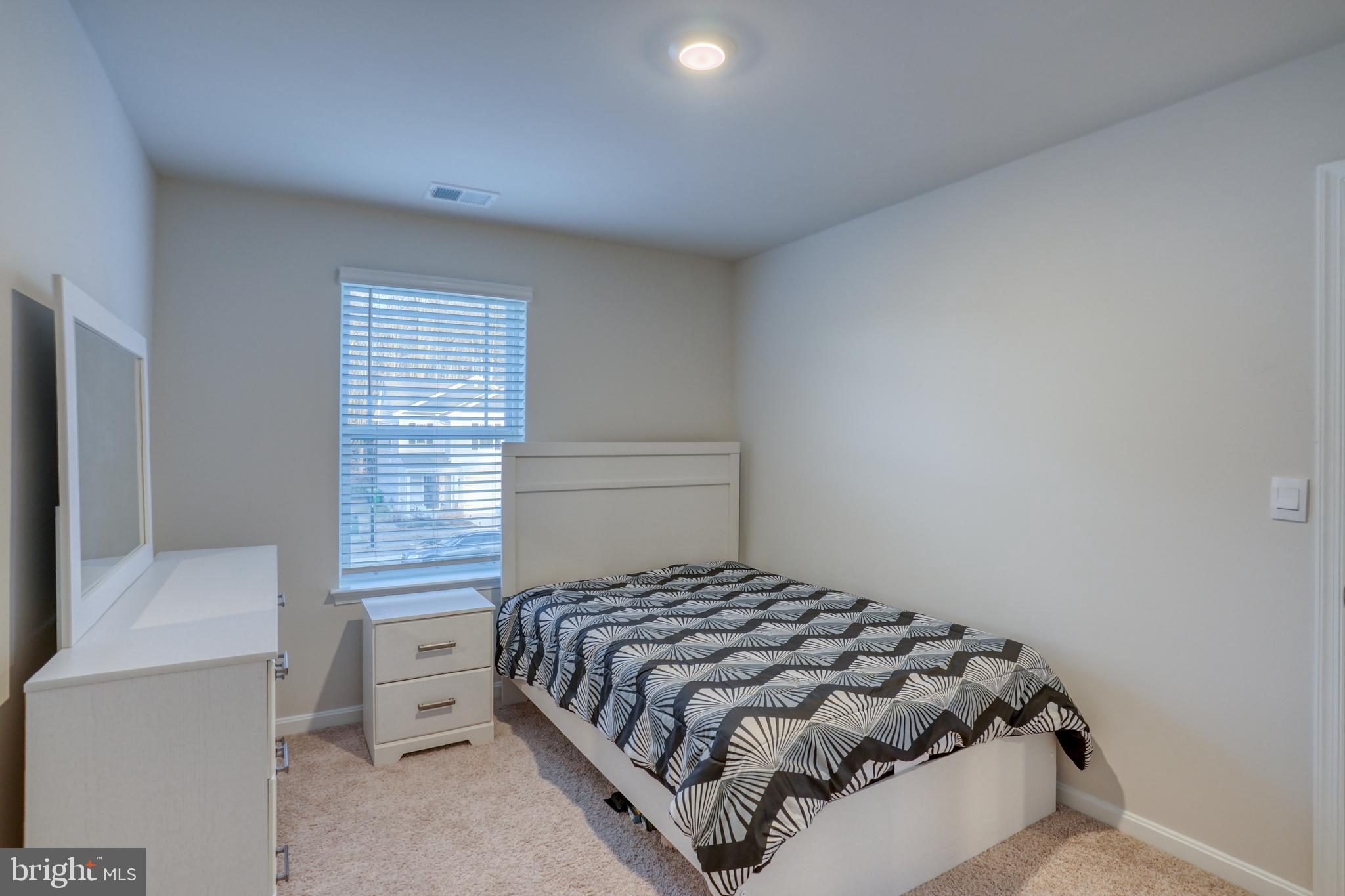 124 Currant Circle Magnolia, DE 19962 - Photo 29 of 45 a bedroom with a bed and window