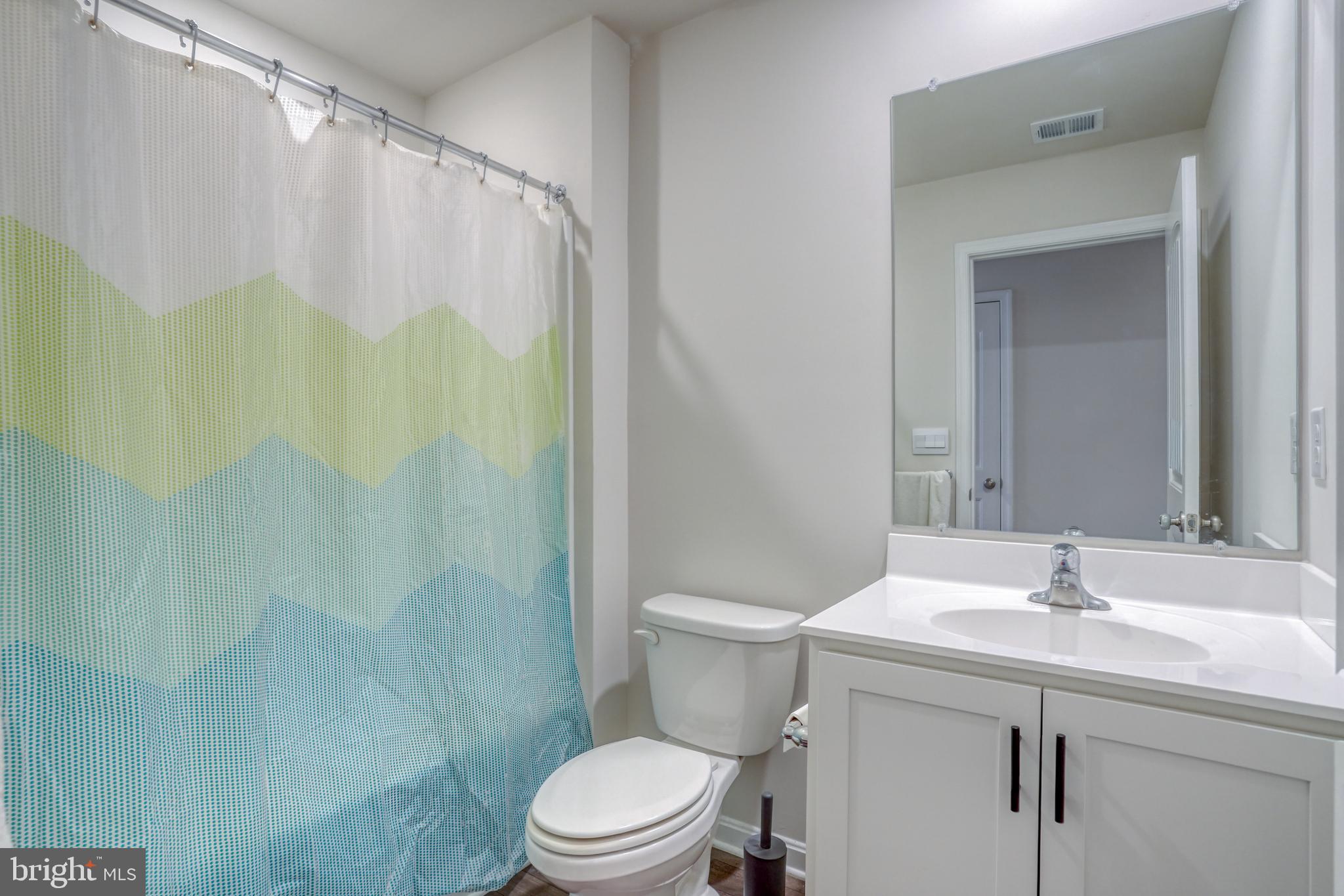 124 Currant Circle Magnolia, DE 19962 - Photo 33 of 45 a bathroom with a sink a toilet and shower