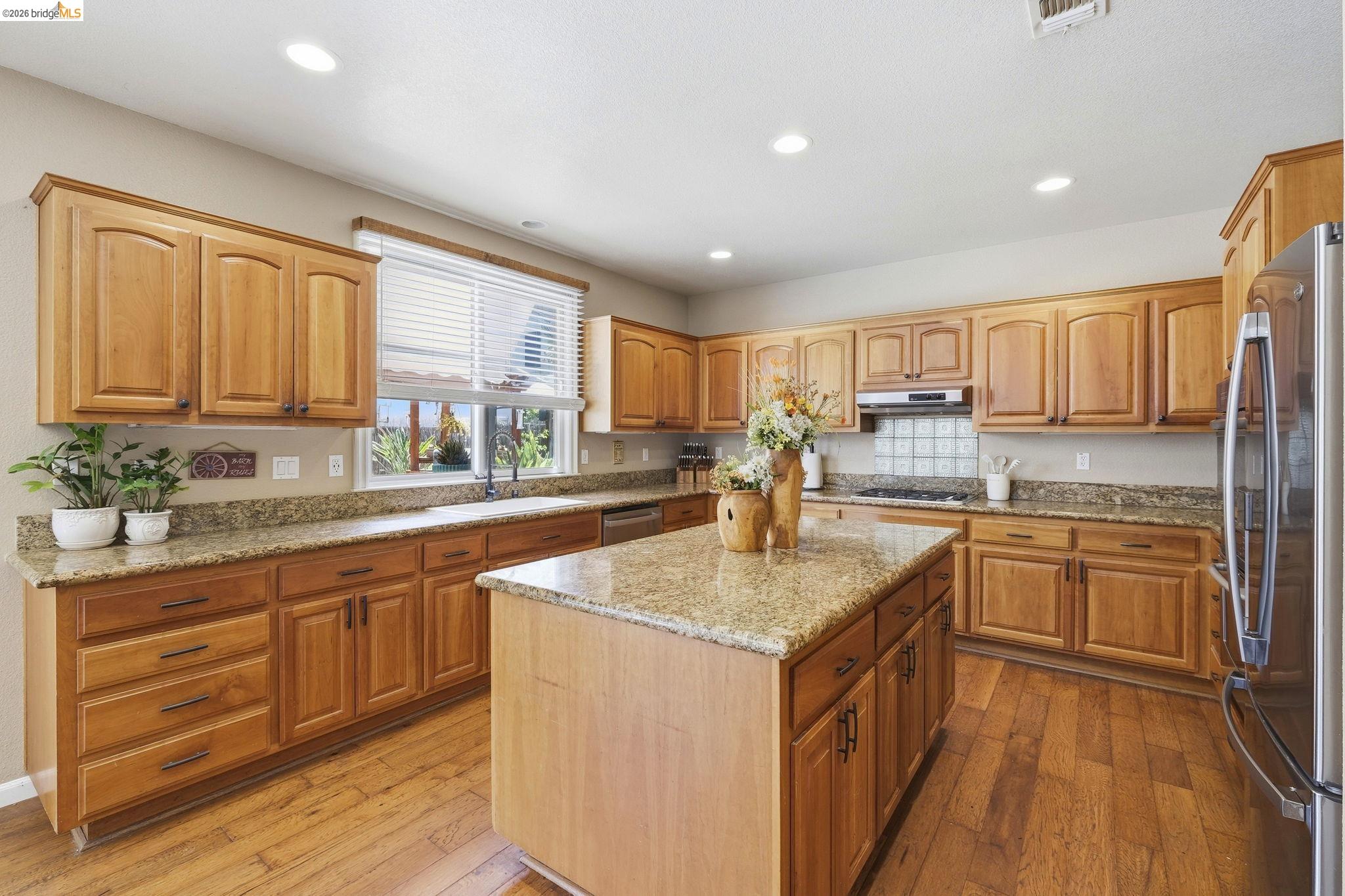 3438 Keystone Loop Discovery Bay, CA 94505 - Photo 10 of 57 a kitchen with stainless steel appliances granite countertop a sink stove and cabinets