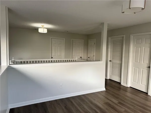 an empty room with wooden floor