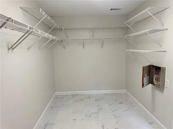 a view of a room with racks on the wall