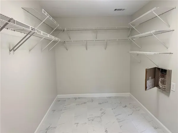 a view of a room with racks on the wall