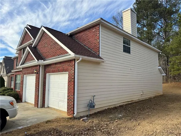 a view of a house with a garage