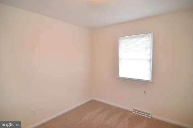 a view of a room with an empty space
