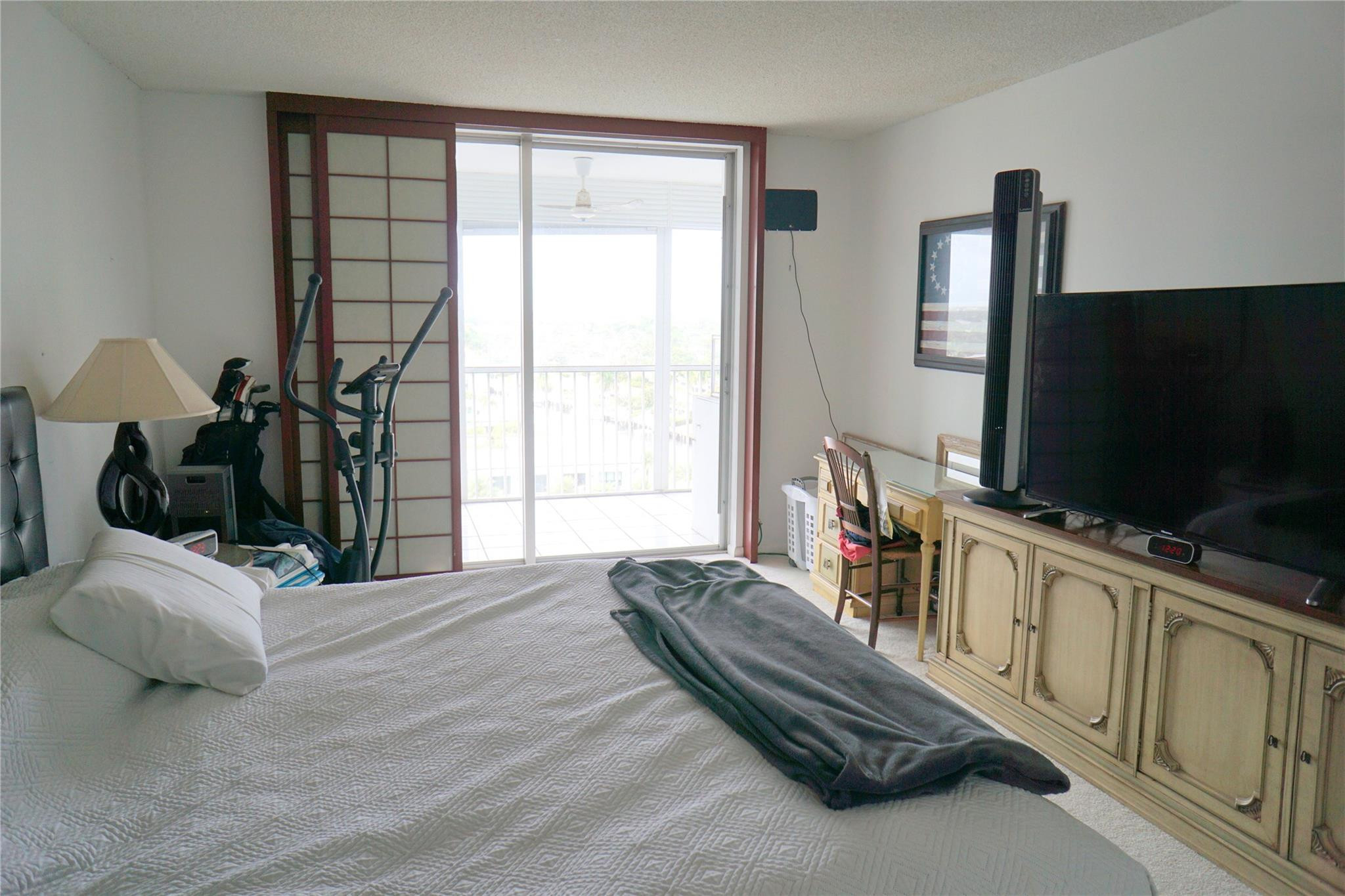 303 North Riverside Drive, Unit PH4 Pompano Beach, FL 33062 - Photo 19 of 52 a living room with furniture and a flat screen tv