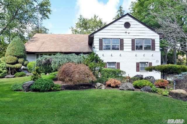 270 Pepperidge Road Hewlett Harbor, NY 11557 - Photo 1 of 1 a front view of a house with a garden