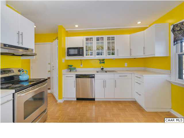 1423 Ricky Road Charlottesville, VA 22901 - Photo 7 of 16 a view of a kitchen with wooden floor and a sink
