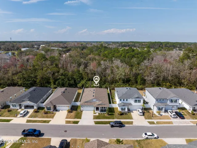 an aerial view of a house with a lake view
