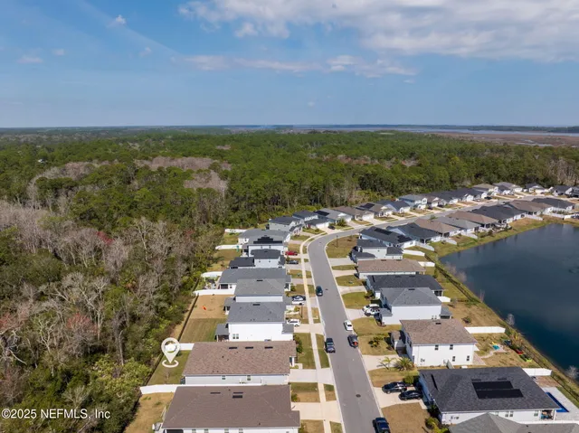 an aerial view of residential houses with outdoor space