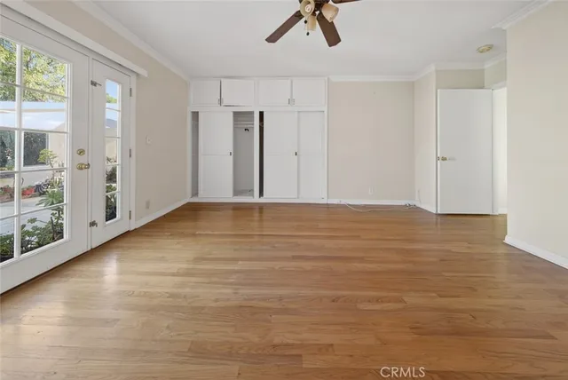 a view of room with window and ceiling fan