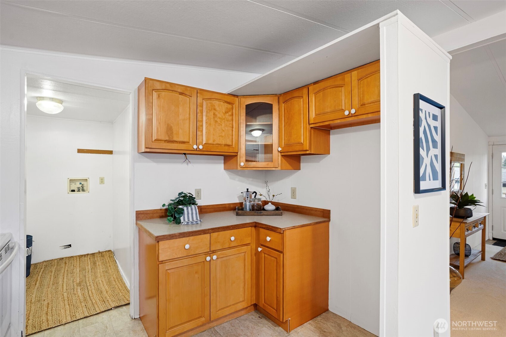 19015 16th Avenue Northeast Shoreline, WA 98155 - Photo 11 of 37 a kitchen with stainless steel appliances granite countertop a sink stove and cabinets
