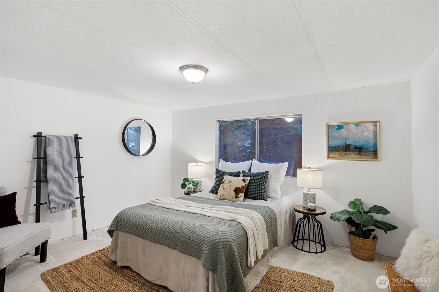 19015 16th Avenue Northeast Shoreline, WA 98155 - Photo 15 of 37 a bedroom with a bed and a potted plant