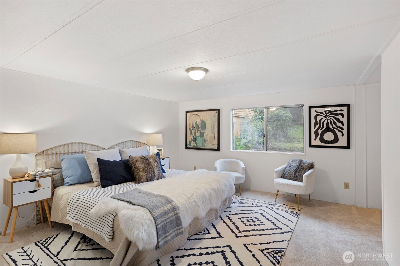 19015 16th Avenue Northeast Shoreline, WA 98155 - Photo 16 of 37 a bedroom with a bed and a couch