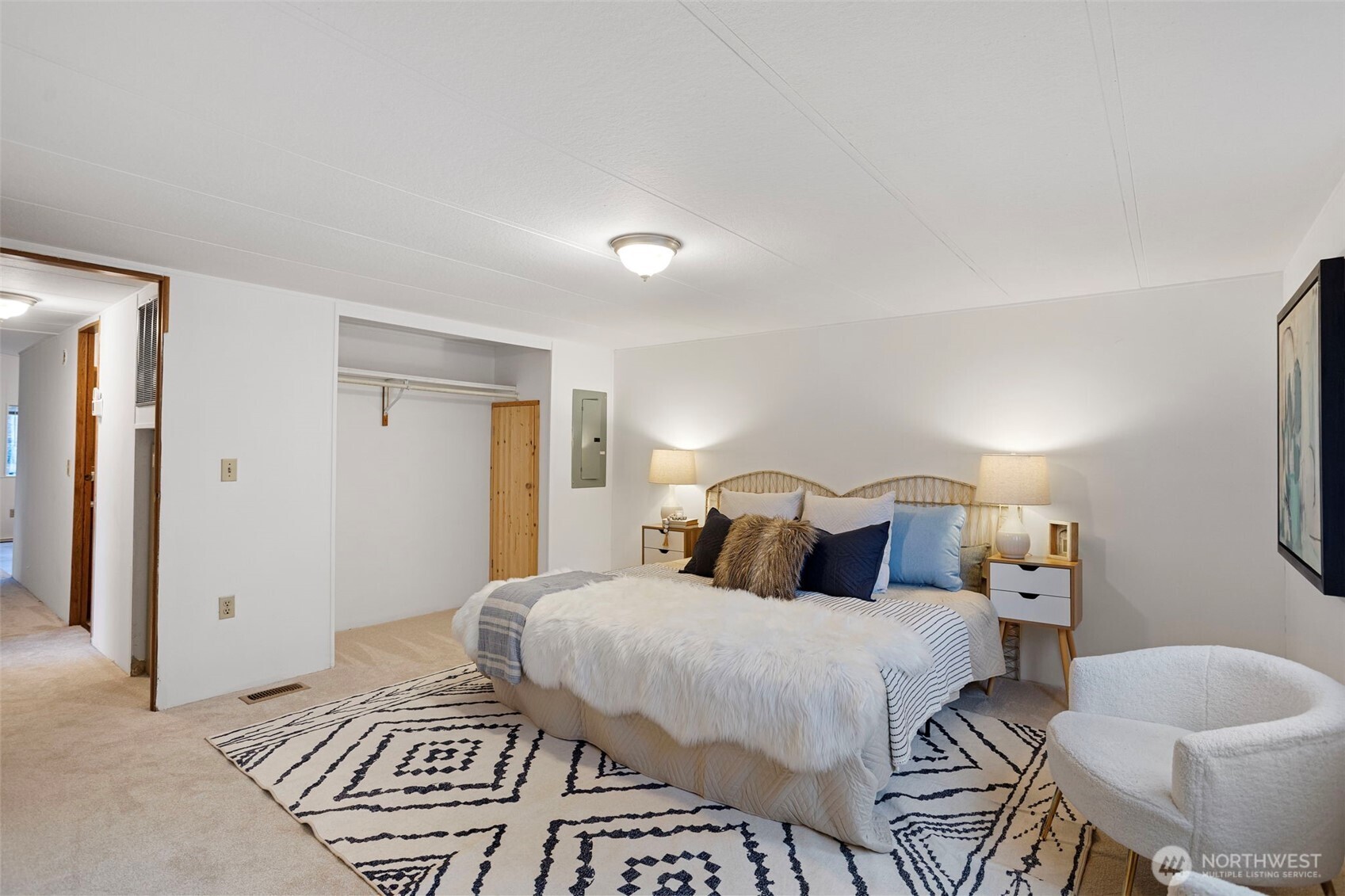 19015 16th Avenue Northeast Shoreline, WA 98155 - Photo 17 of 37 a bedroom with a bed and a lamp with the dresser