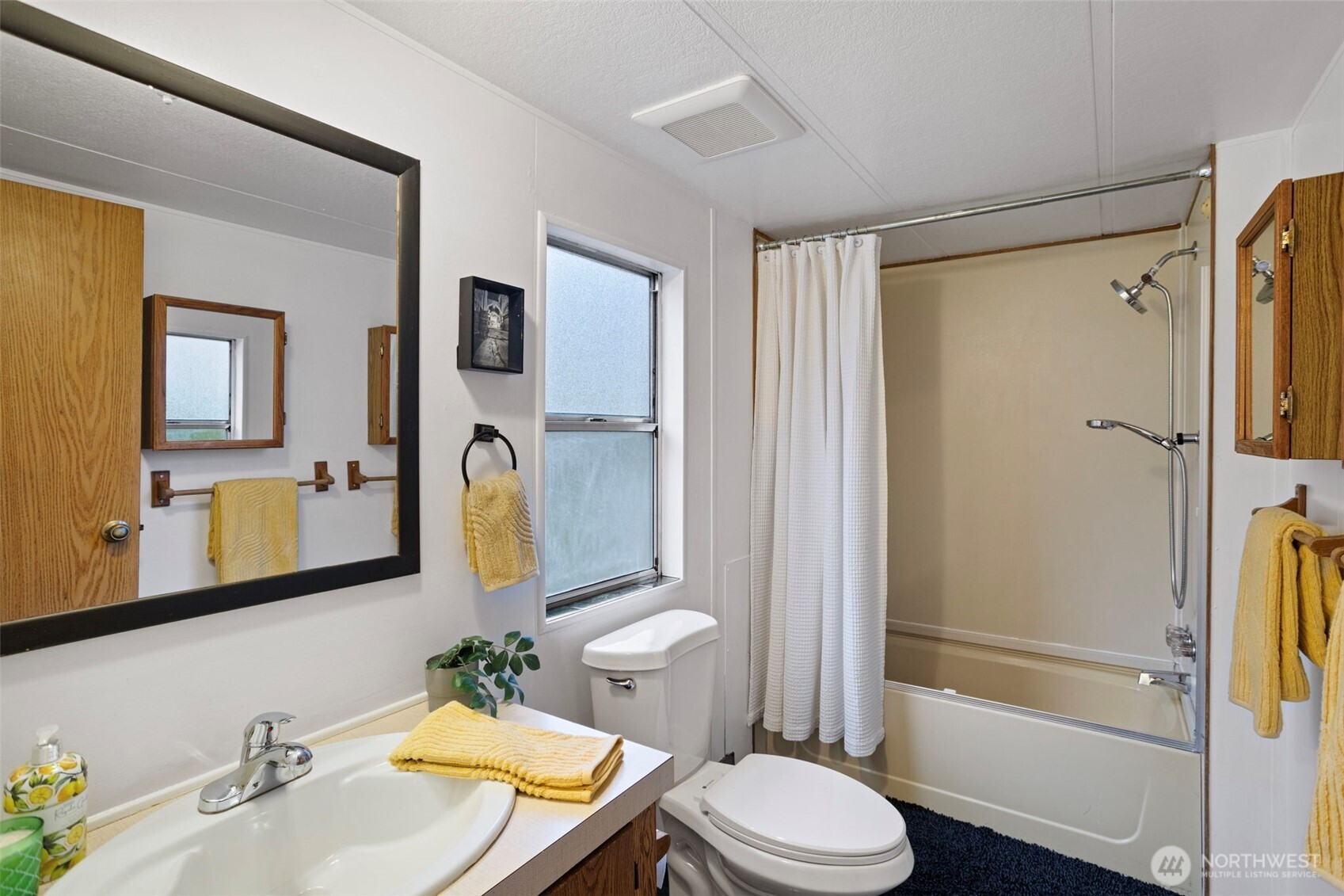 19015 16th Avenue Northeast Shoreline, WA 98155 - Photo 18 of 37 a bathroom with a sink toilet and shower
