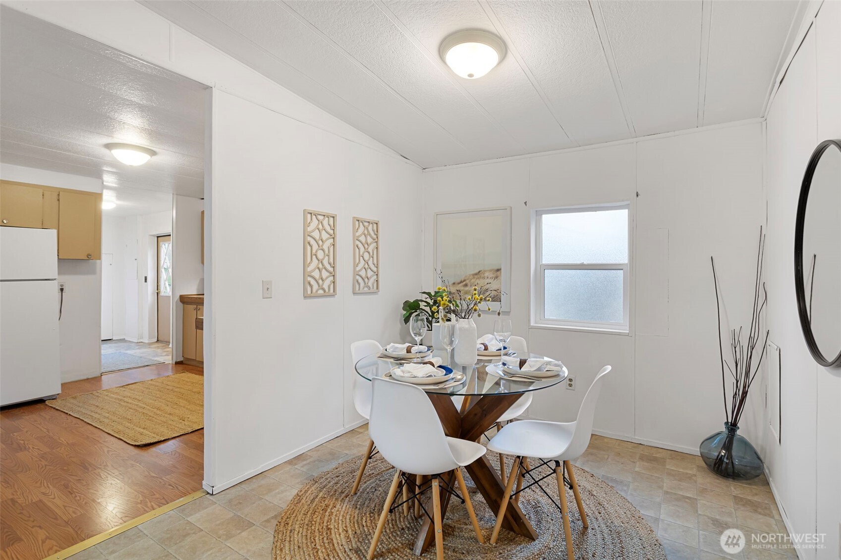 19015 16th Avenue Northeast Shoreline, WA 98155 - Photo 22 of 37 a view of a dining room with furniture and a chandelier