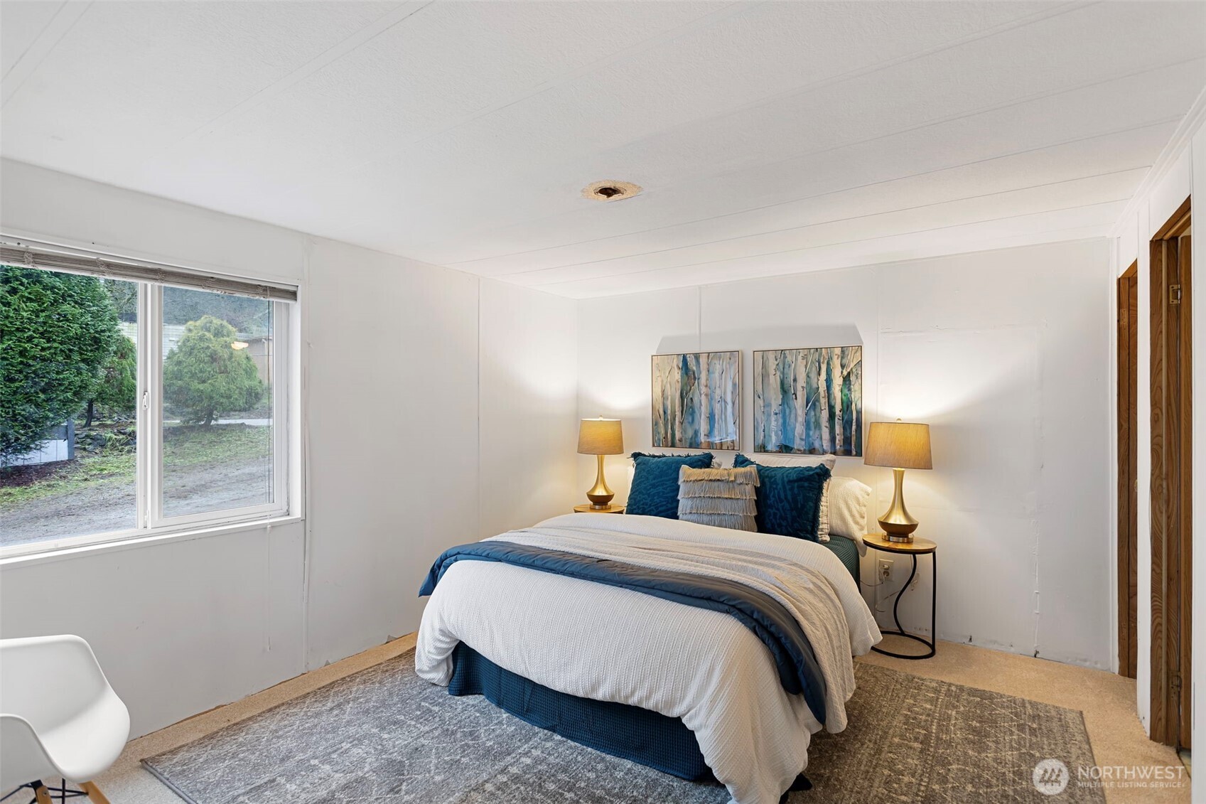 19015 16th Avenue Northeast Shoreline, WA 98155 - Photo 27 of 38 a bedroom with a bed and window