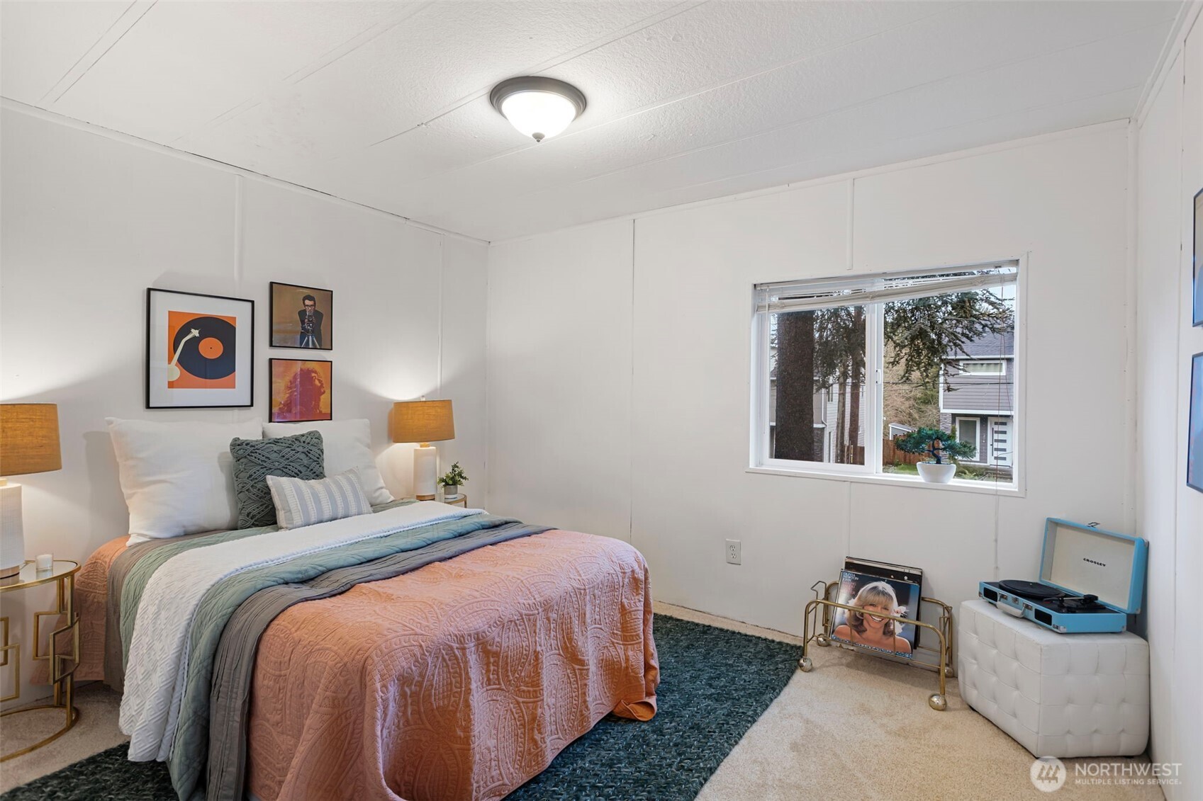 19015 16th Avenue Northeast Shoreline, WA 98155 - Photo 29 of 37 a bedroom with a bed and wooden floor