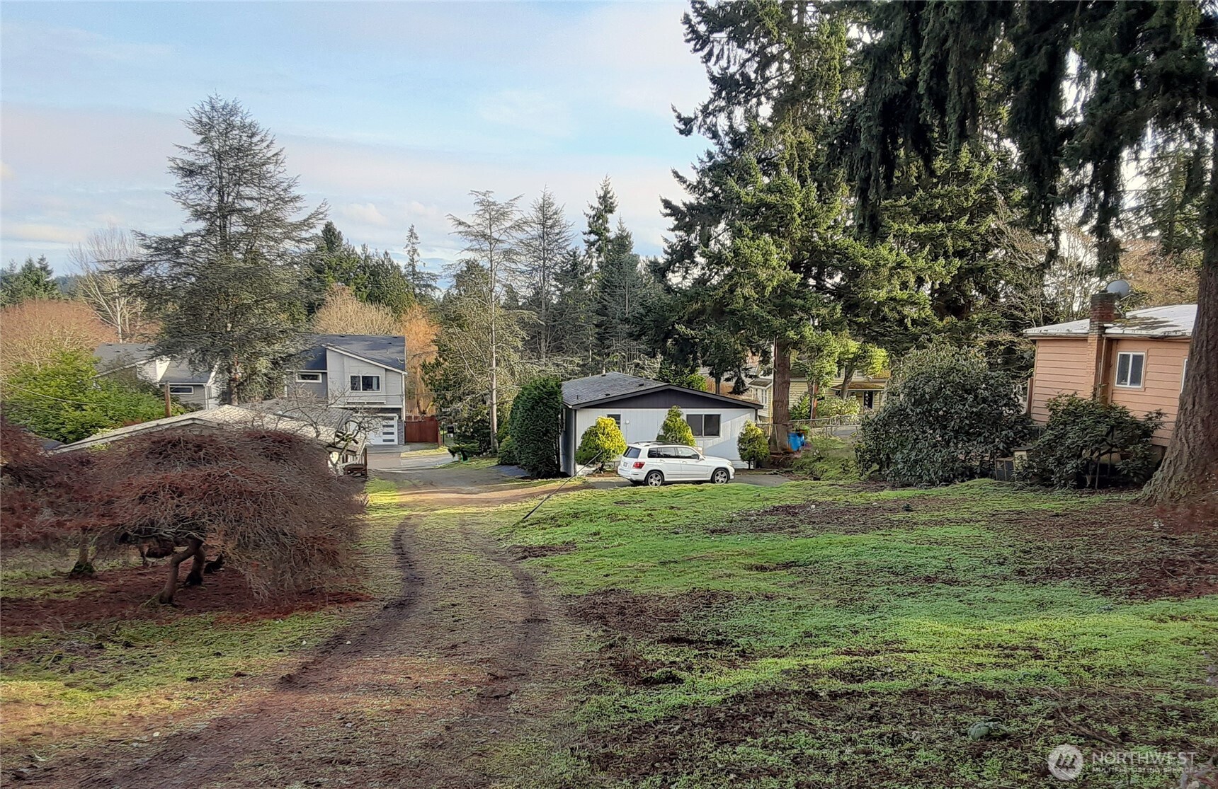 19015 16th Avenue Northeast Shoreline, WA 98155 - Photo 35 of 37 a view of a house with a yard and tree s
