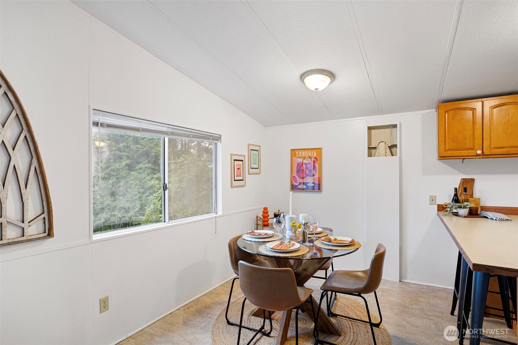 19015 16th Avenue Northeast Shoreline, WA 98155 - Photo 8 of 37 a view of a dining room with furniture window and outside view